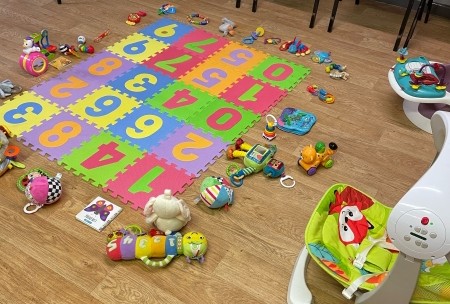 Toys and a play mat on the floor